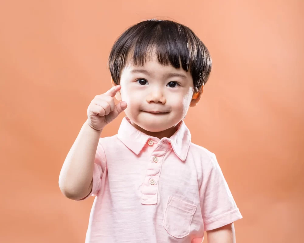 asian-baby-boy-finger-pointing-front-min