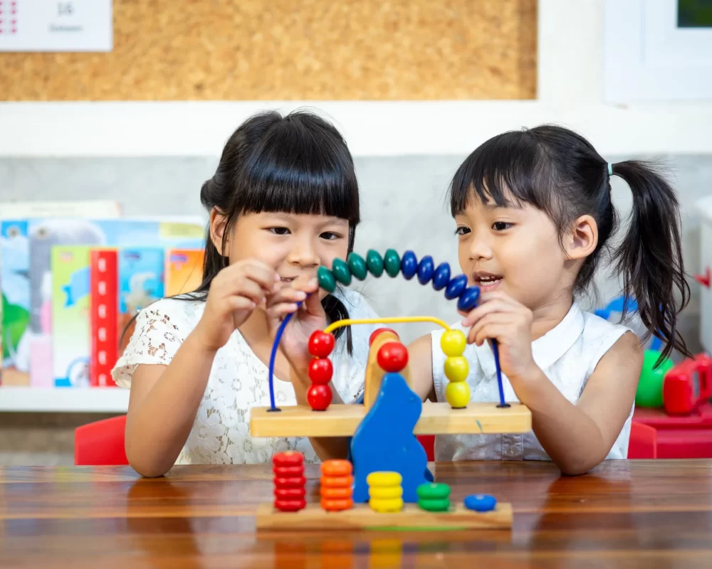 child-little-girl-playing-wooden-toy